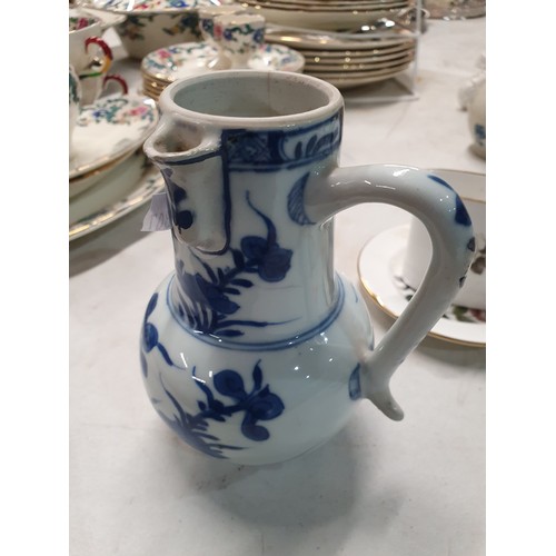 307 - A Chinese famille rose Jug and Cover, a Chinese blue and white Teapot and Cover A/F, a Chinese blue ... 