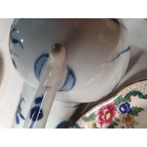 307 - A Chinese famille rose Jug and Cover, a Chinese blue and white Teapot and Cover A/F, a Chinese blue ... 