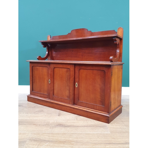 717 - A mahogany table-top Chiffonier, the raised back with scrolled supports above a pair of cupboard doo... 