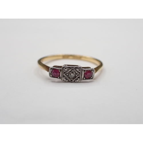 155 - A Diamond and Ruby three stone Ring millegrain-set old-cut diamond between two cushion-cut rubies, s... 