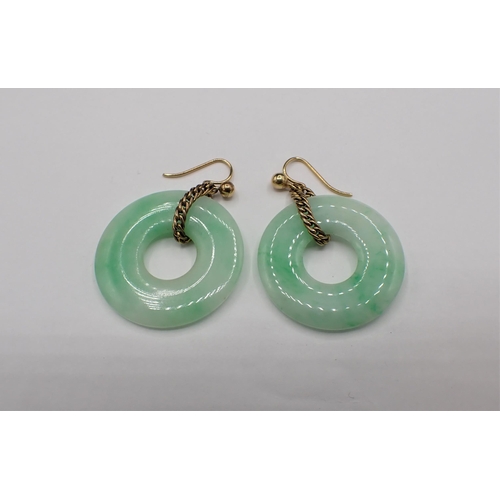 156 - A pair of Jade Earrings each with pierced disc on wire fittings, approx 25mm diameter, approx 7.80gm... 