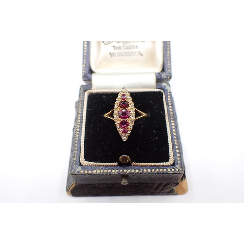 157 - An Edwardian Ruby and Diamond Ring pavé-set five graduated cushion-cut rubies (one replaced with gla... 