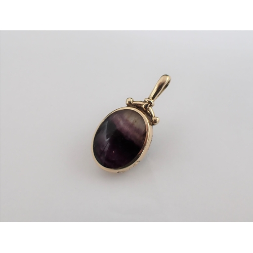 179 - A Blue John Pendant set oval stone in 9ct gold frame, approx  37mm long including bale, approx 10.70... 