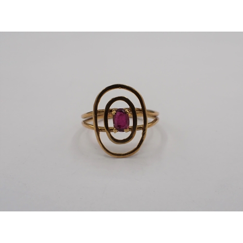 182 - A Ruby Ring claw-set oval-cut stone in halo frame, ring size M 1/2, approx 2.50gms