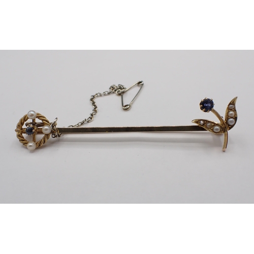 185 - A Sapphire and Seed Pearl Bar Brooch, stamped 15ct, approx 6cms long, approx 4.30gms