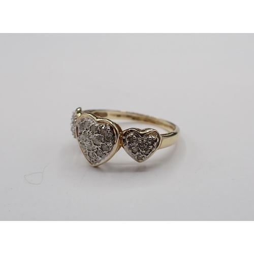 190 - A triple heart Ring pavé-set numerous diamond chips in 9ct gold, ring size L 1/2, approx 2gms