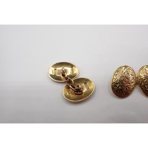 197 - A pair of oval 18ct gold Cufflinks with scroll engraving, approx 10.80gms