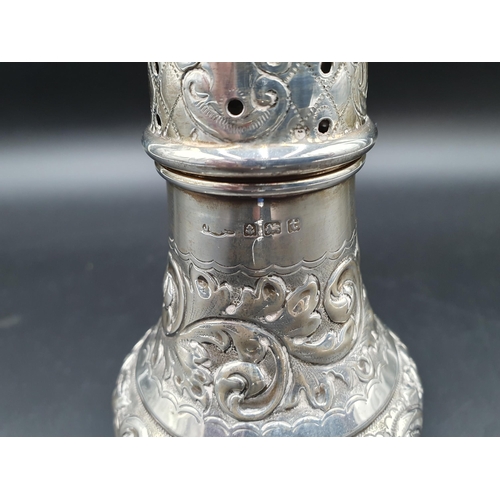 110 - A George V silver Sugar Caster with leafage scroll embossing, Birmingham 1918