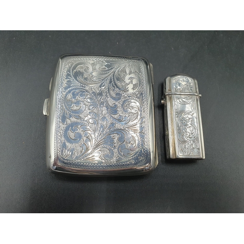 119 - A George V silver Cigarette Case with leafage scroll engraving and initials, Birmingham 1918, and an... 