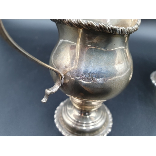 120 - An Edward VII silver Cream Jug with gadroon rim on pedestal base, London 1903 and matching Sugar Bow... 