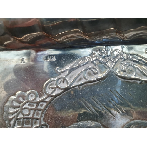 128 - An Edward VII silver Dressing Table Tray embossed cherub masks, Birmingham 1903, 10 x 7 1/2in