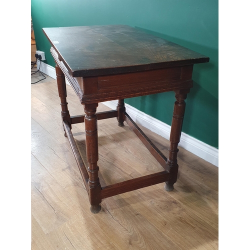 17 - An 17th Century oak Side Table fitted frieze drawer with moulded edge and raised on turned supports ... 