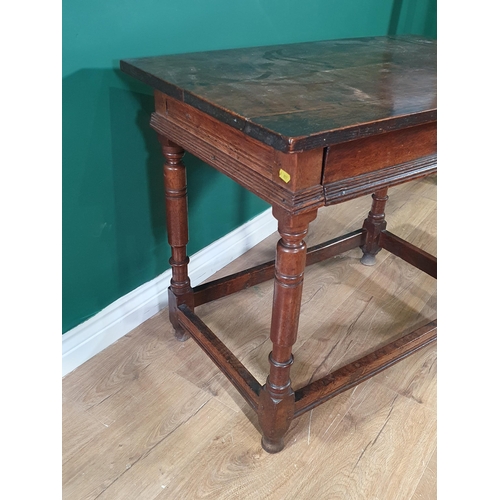 17 - An 17th Century oak Side Table fitted frieze drawer with moulded edge and raised on turned supports ... 