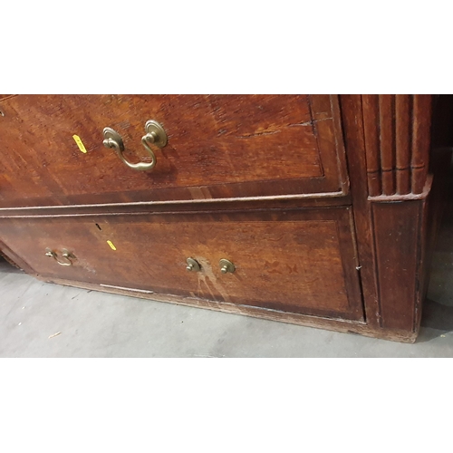 239 - A 19th Century oak and mahogany cross banded Bureau fitted two short and three long drawers, lacking... 