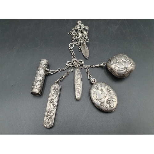 252 - A Continental Chatelaine with mistletoe decoration, includes mirror, compact, scent bottle, scissors... 