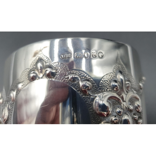 277 - A Victorian silver Goblet with embossed design, leafage knop stem, presentation inscription and bead... 