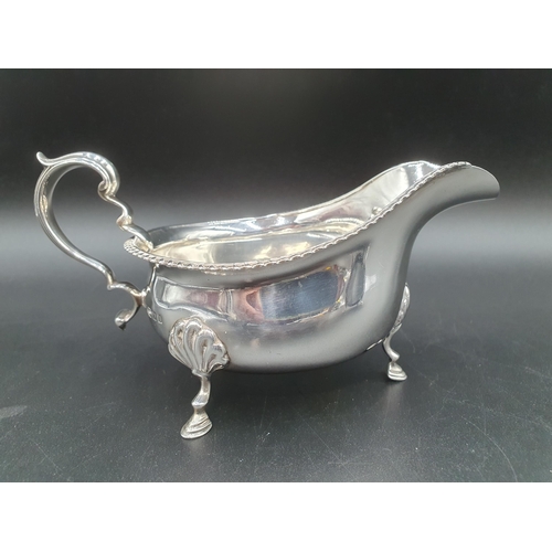 291 - A George V silver Sauce Boat with gadroon rim on three hoof feet, London 1925, and another, Birmingh... 