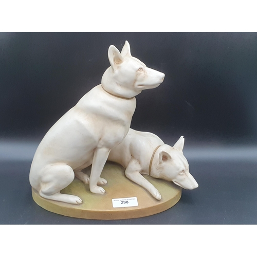 298 - Two Royal Dux Dogs on oval green oval plinth, 12in, one ear chipped (R1)