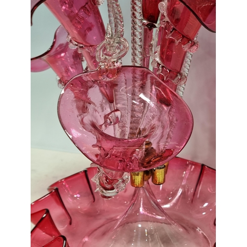 301 - A Victorian cranberry glass Epergne with flared and suspended flutes, 1ft 7in H