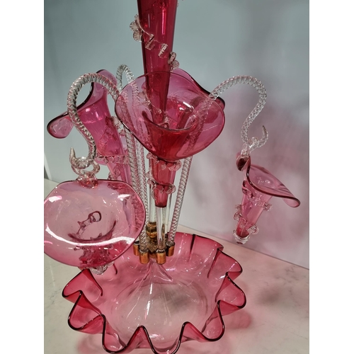 301 - A Victorian cranberry glass Epergne with flared and suspended flutes, 1ft 7in H