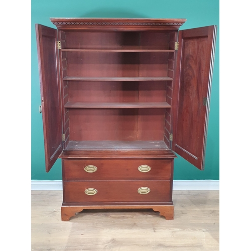 35 - A 19th Century mahogany Cupboard  fitted pair of panelled doors enclosing shelves above base fitted ... 