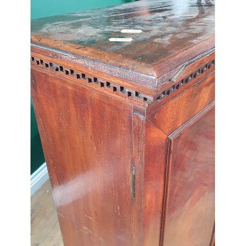 35 - A 19th Century mahogany Cupboard  fitted pair of panelled doors enclosing shelves above base fitted ... 