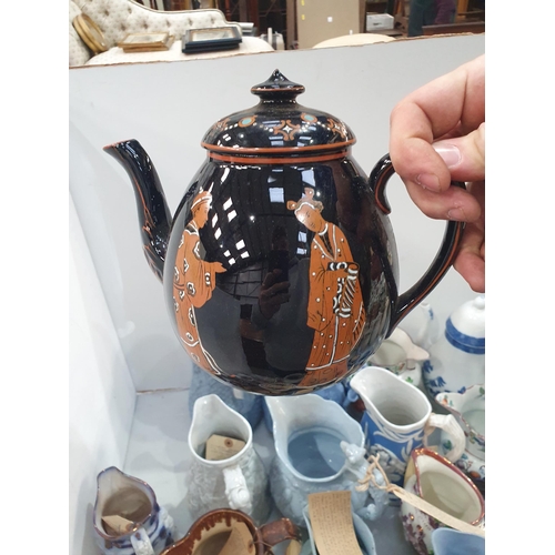 370 - A collection of ceramic and pottery Jugs and Teapots including a Willow Pattern Coffee Pot, A/F, a W... 