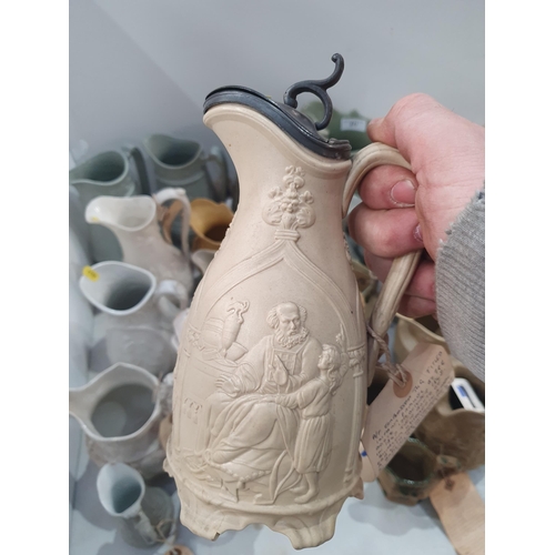 371 - A collection of moulded relief Jugs including a W.Ridgway & Son Jug with tavern scene, an embossed P... 