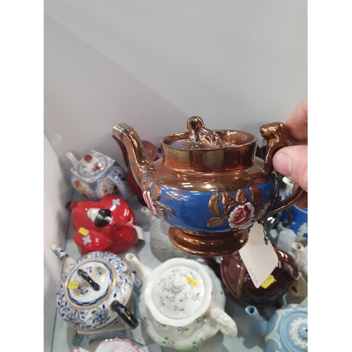 375 - A collection of Ceramic Teapots including, a green and silver Racing Car Teapot registered no 820236... 