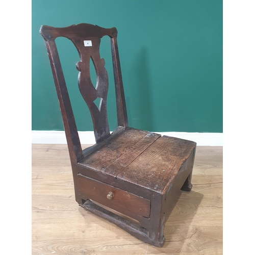 41 - An 18th Century oak Lambing Chair with pierced splat back and box base fitted side drawers 2ft 8in H... 