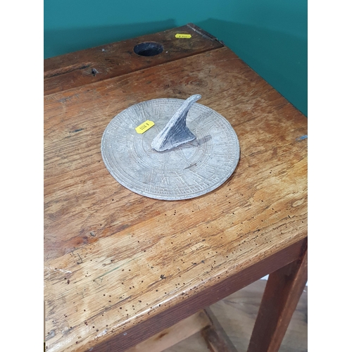 42 - A vintage oak School Desk, 2ft 8in High x 2ft Wide x 1ft 6in Deep, a Sundial and an Iron. (R9).