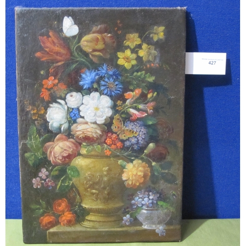 427 - CONTINENTAL SCHOOL. A Still Life of mixed Flowers in an urn, oil on canvas, unframed, 16 x 11 1/2 in... 