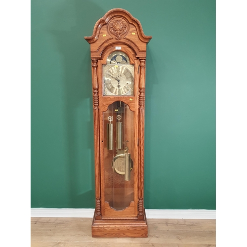 475 - A reproduction oak Longcase Clock with moon phase arched brass dial inscribed Sligh, with 8 day West... 