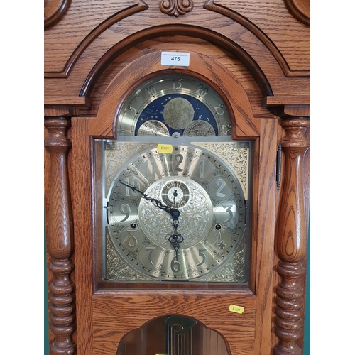 475 - A reproduction oak Longcase Clock with moon phase arched brass dial inscribed Sligh, with 8 day West... 