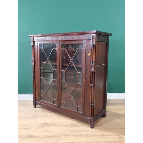 516 - A mahogany Display Cabinet, with carved frieze above pair of astragal glazed doors enclosing two fit... 