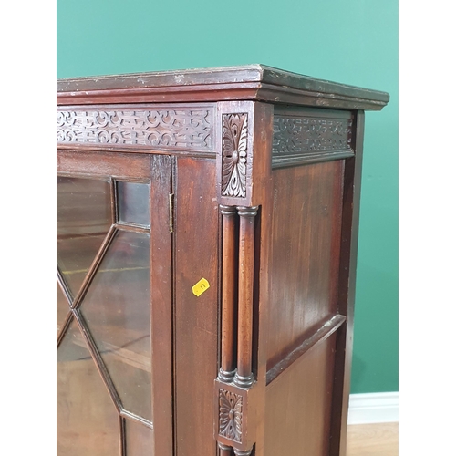 516 - A mahogany Display Cabinet, with carved frieze above pair of astragal glazed doors enclosing two fit... 