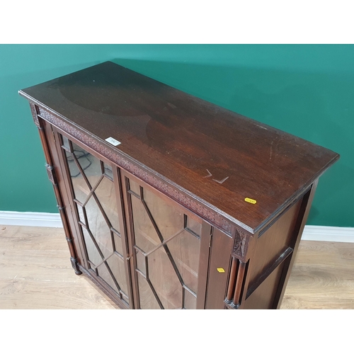 516 - A mahogany Display Cabinet, with carved frieze above pair of astragal glazed doors enclosing two fit... 