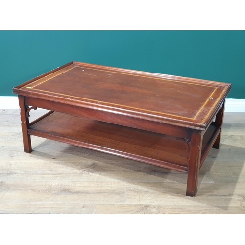 517 - A reproduction mahogany two tier Coffee table on chamfered supports, 16in High x 3ft 7in Long x 2ft ... 