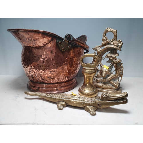 536 - A copper Coal Bucket with swing handle, A/F, a Hunting scene Door Porter, a brass Weight and a Croco... 