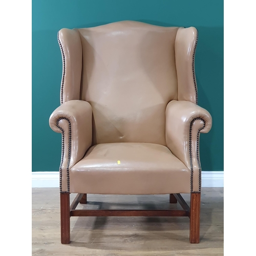 583 - A Georgian style winged Armchair with tan leather upholstery on square supports 3ft 3in H x 2ft 5in ... 