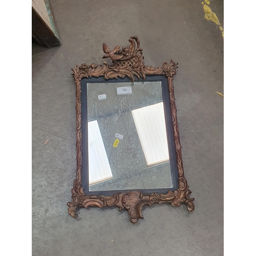 599 - An oval gilt Wall Mirror with urn surmount flanked by foliage, above a shelf, 3ft H A/F and a gilt f... 