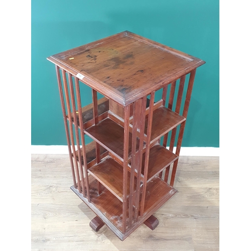 619 - An Edwardian mahogany revolving Bookcase, 2ft square, 51in high (R7)