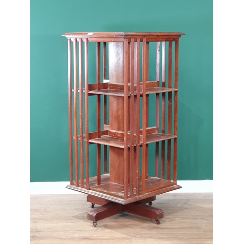 619 - An Edwardian mahogany revolving Bookcase, 2ft square, 51in high (R7)