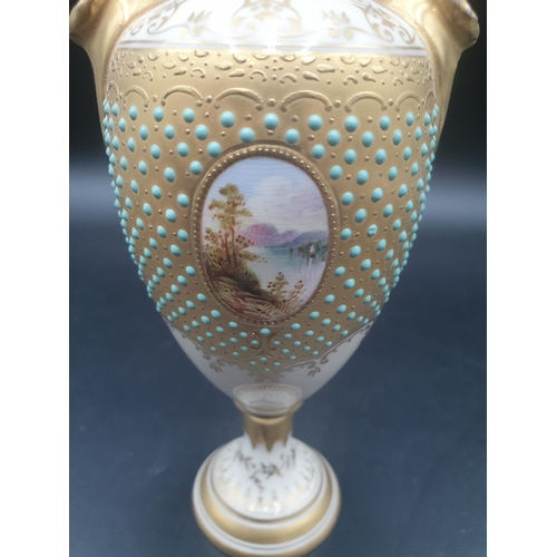 62 - A Coalport Cabinet Vase with oval cartouche painted Lake Leven, turquoise jewelled surround on gilt,... 