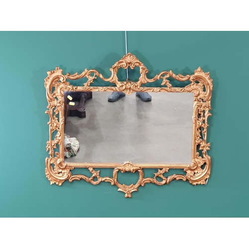 633 - A reproduction gilt scroll framed Wall Mirror, 32in W x 29in H (R7)