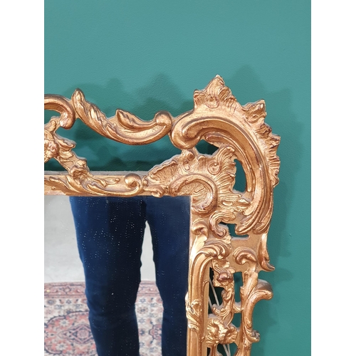 633 - A reproduction gilt scroll framed Wall Mirror, 32in W x 29in H (R7)