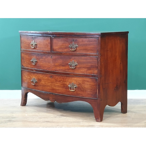 635 - A 19th Century mahogany Bow front Chest of two short, two long Drawers above shaped frieze, on splay... 