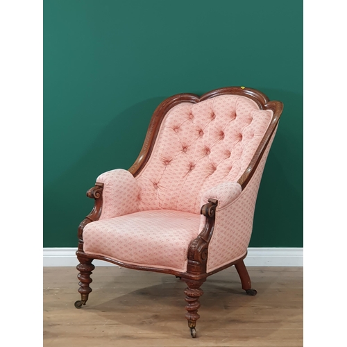 644 - A carved oak framed button upholstered Armchair