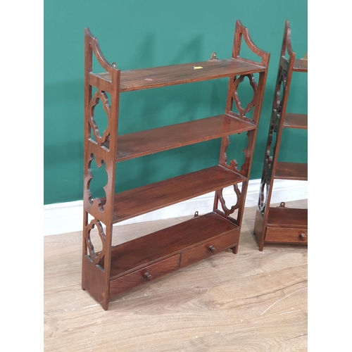 661 - A pair of mahogany Wall Shelves with fret carved sides and fitted drawers to the base, 2ft 3in H x 1... 