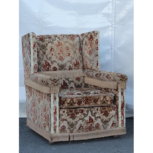 667 - A floral upholstered three seater Knowle Sofa and a pair of Armchairs. (R11).